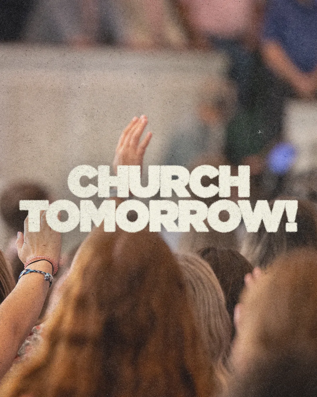 Hands raised in worship amidst a crowd, inviting community and faith for church tomorrow.