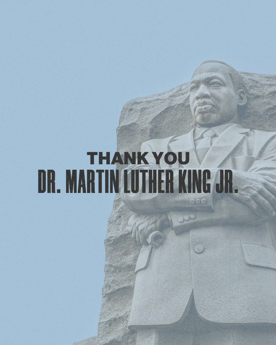 Statue of Dr. Martin Luther King Jr. with a message of gratitude, symbolizing faith, justice, and community service.