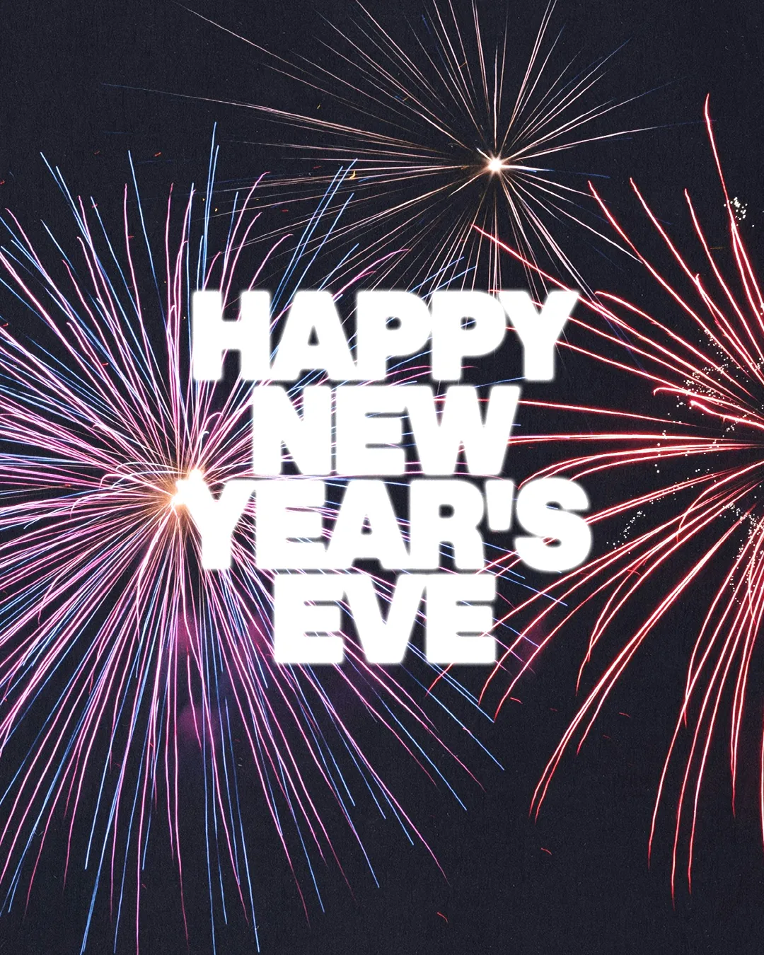 Colorful fireworks illuminate the night sky, celebrating New Year's Eve with joy and community spirit.