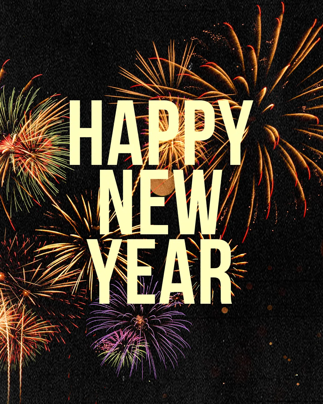 Colorful fireworks illuminate the night sky, celebrating a joyful New Year with a message of hope and renewal.