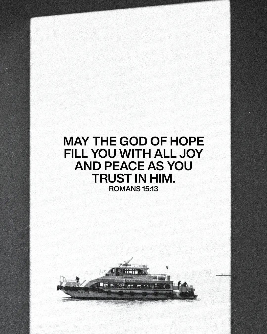 Hopeful message from Romans 15:13 over a serene water scene with a boat, symbolizing faith and peace.