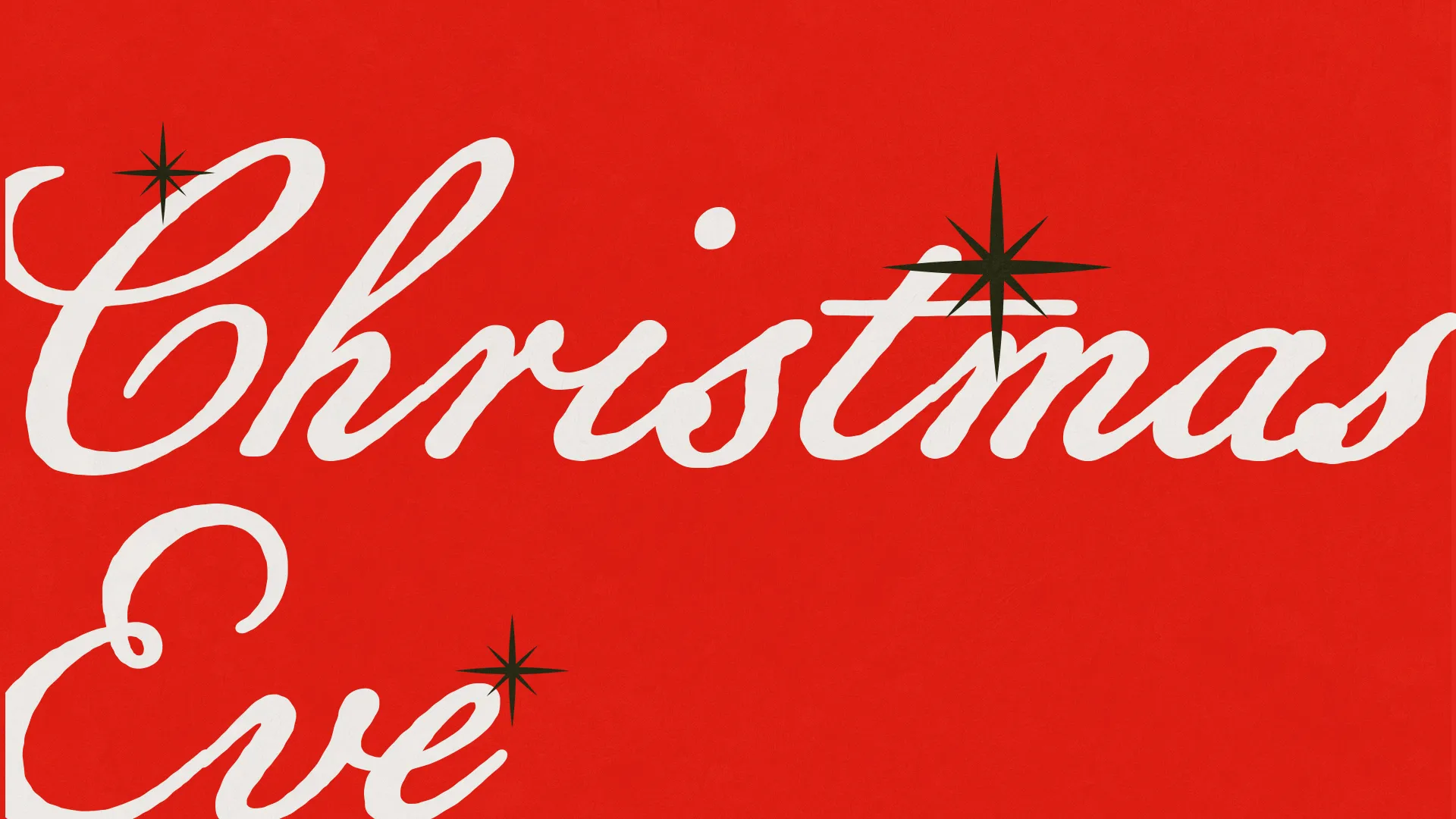 "Festive red background with elegant white script reading 'Christmas Eve,' accented by black starbursts."