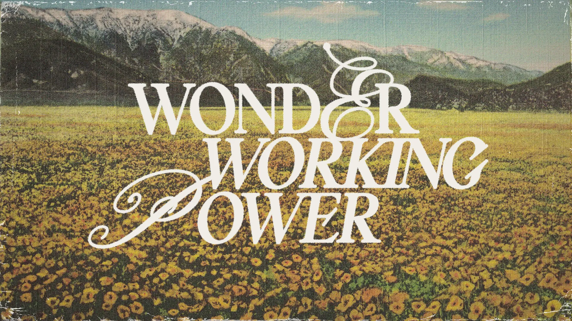 Golden field of flowers with mountains in the background, featuring the text "Wonder Working Power," symbolizing faith and divine strength.