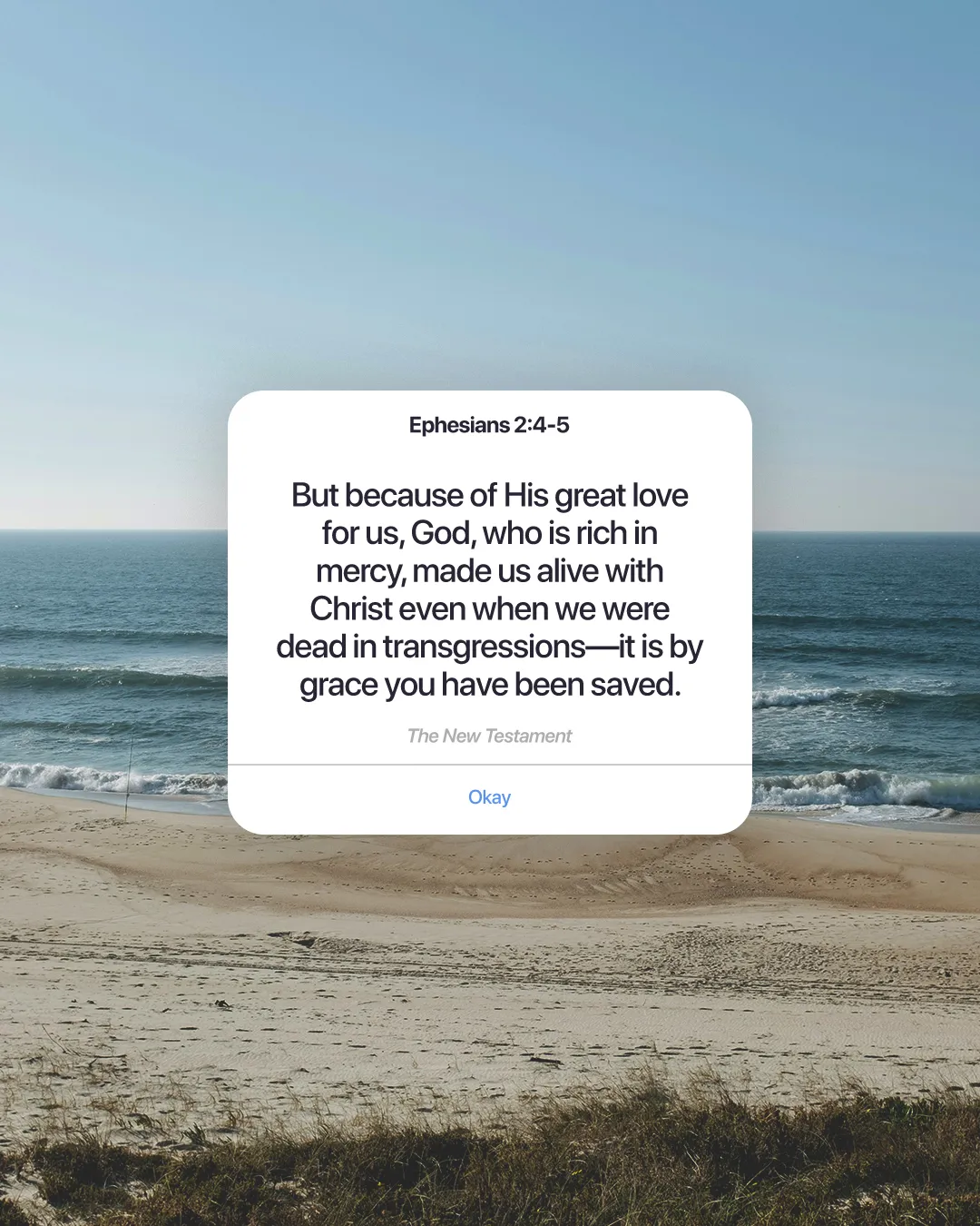 Ephesians 2:4-5 text overlays a serene beach scene, symbolizing grace, mercy, and spiritual renewal in faith.