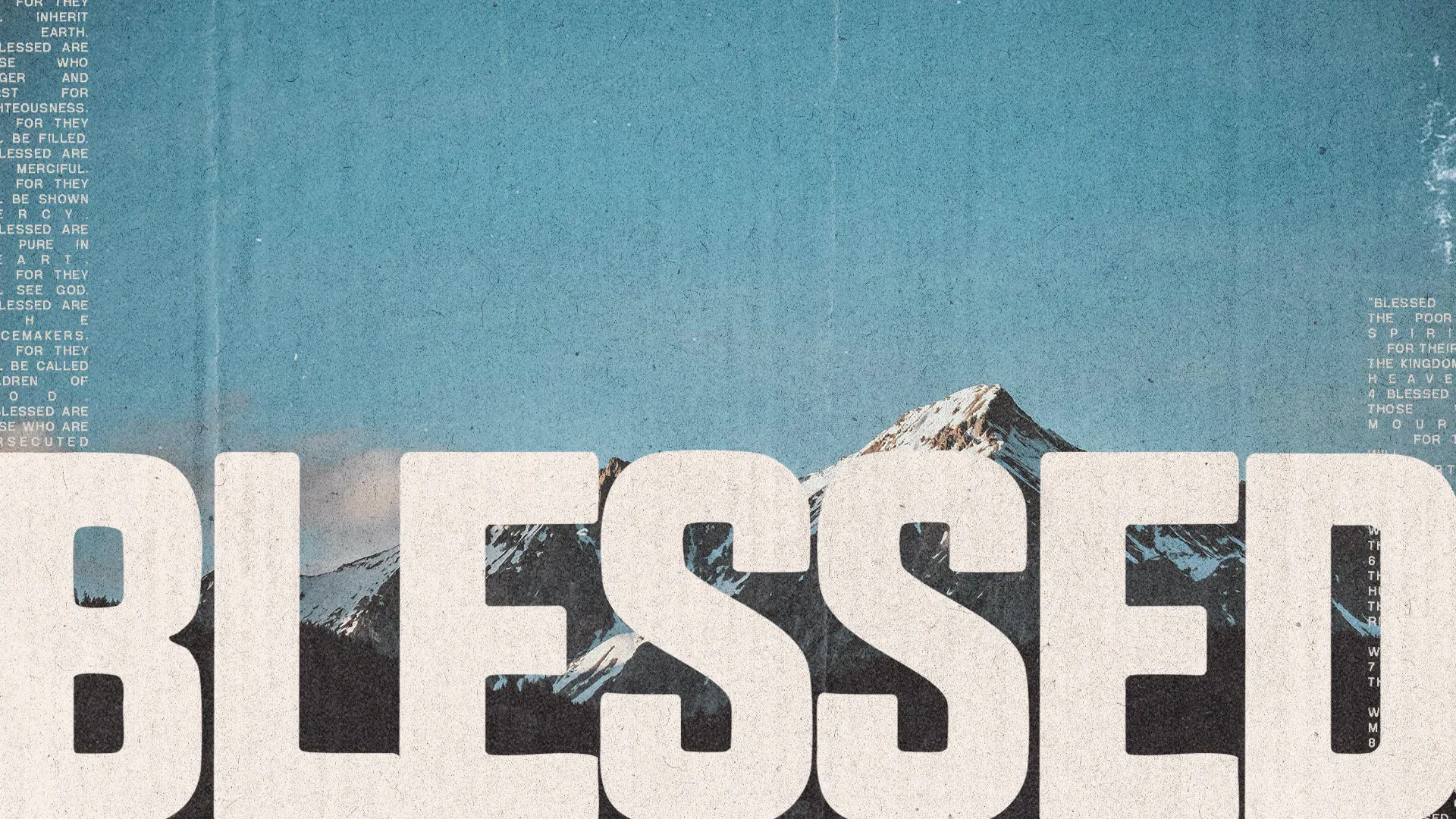 Mountains under a blue sky with the word "BLESSED" prominently displayed, reflecting themes of faith and gratitude.