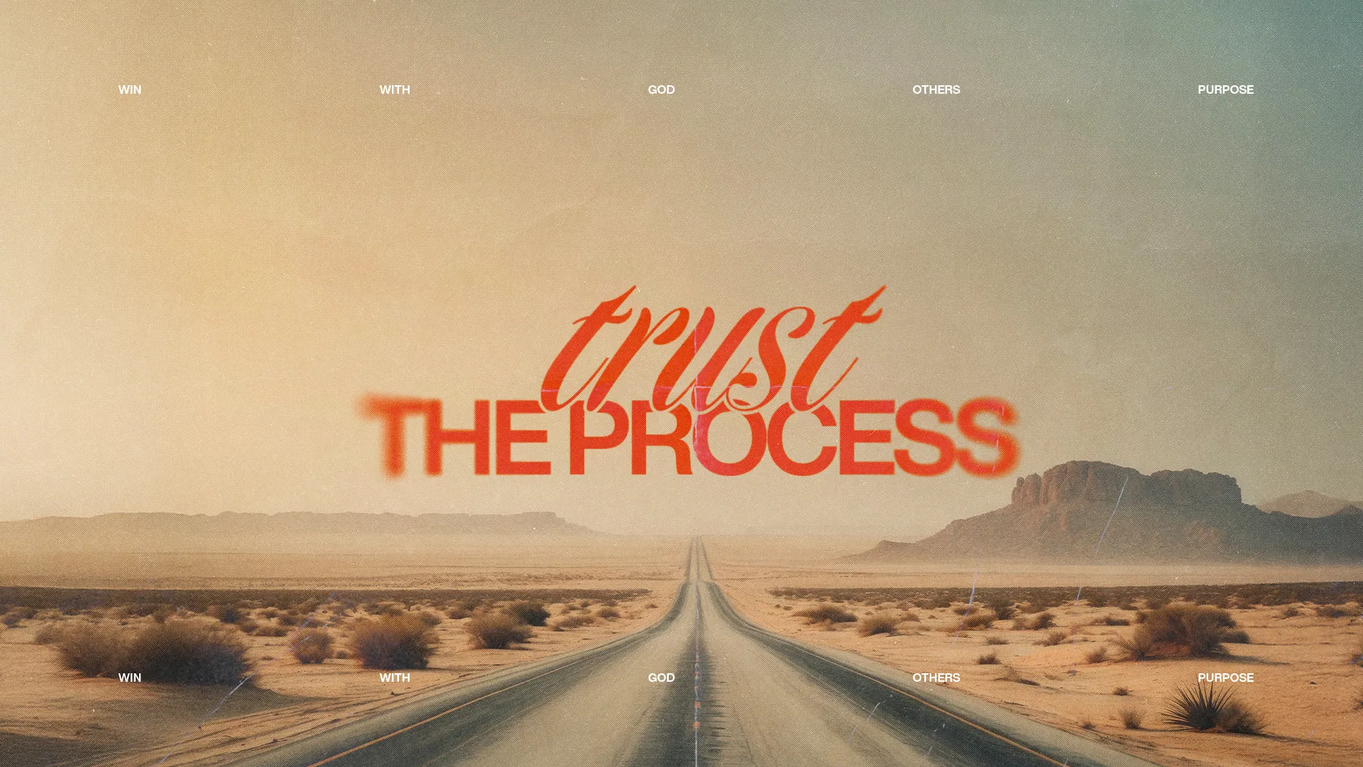 "Desert road leading to mountains, with 'trust the process' emphasizing faith and spiritual journey."