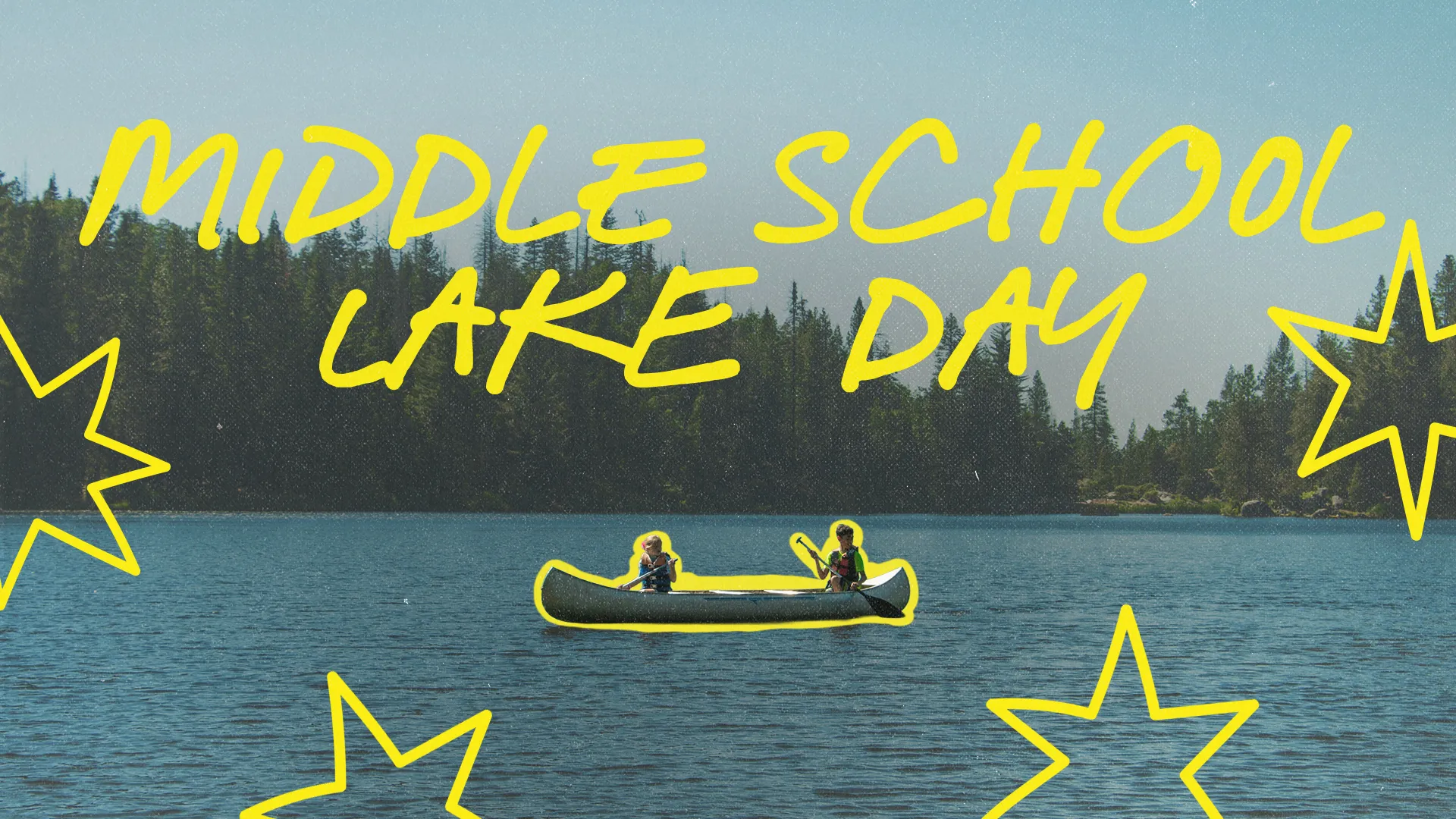 Middle school students enjoy fellowship on a canoe at a serene lake, celebrating community and faith.