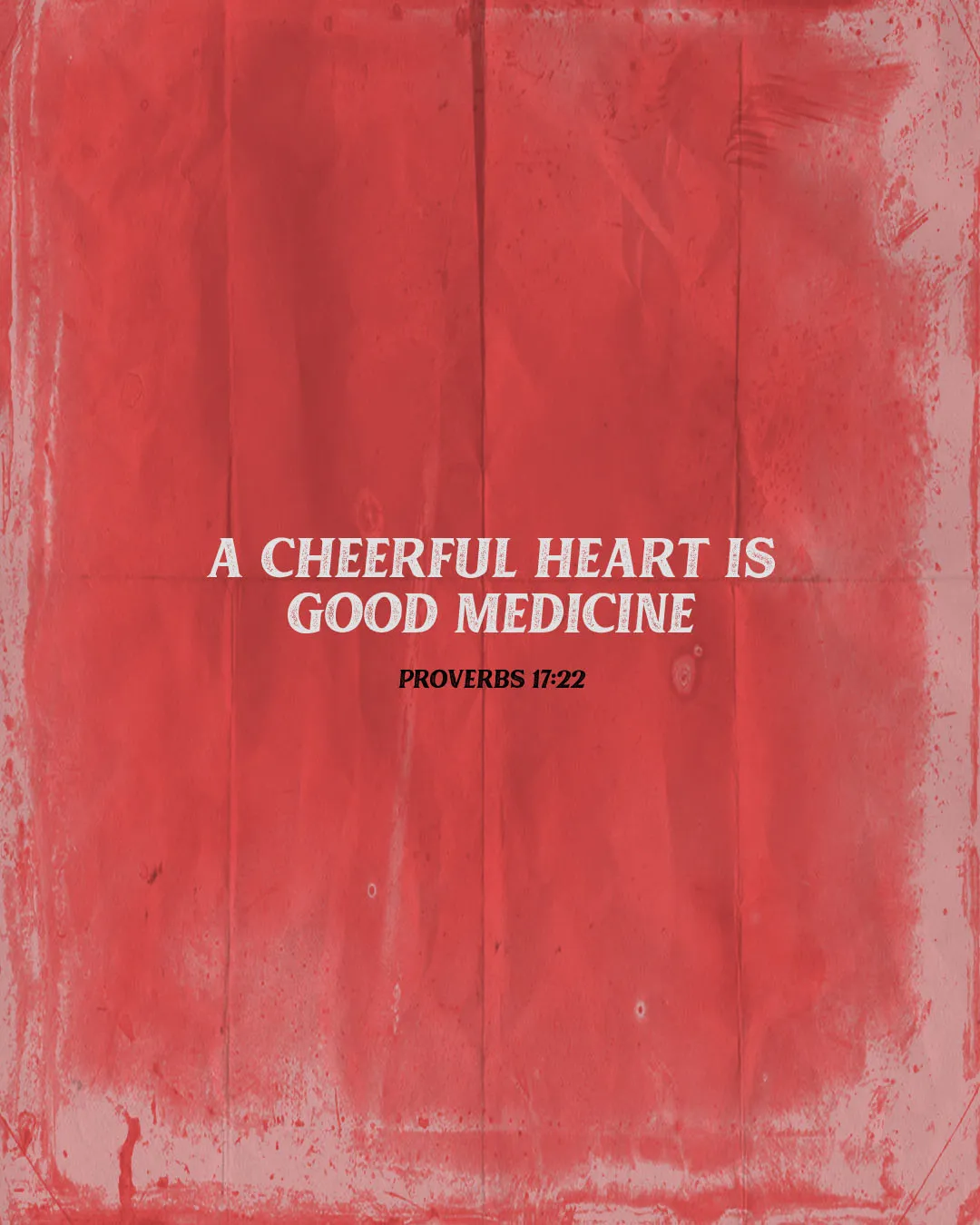 Red textured background with white text reading "A cheerful heart is good medicine Proverbs 17:22" for inspirational church media