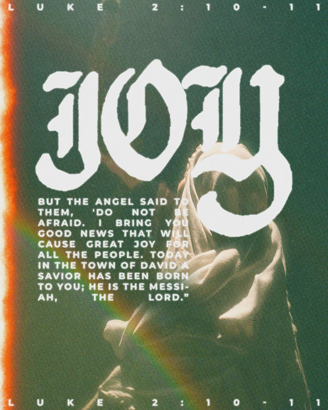 Christmas church media graphic with distressed JOY typography and Luke 2:10-11 scripture text about angel's proclamation over green textured background with warm lighting effects