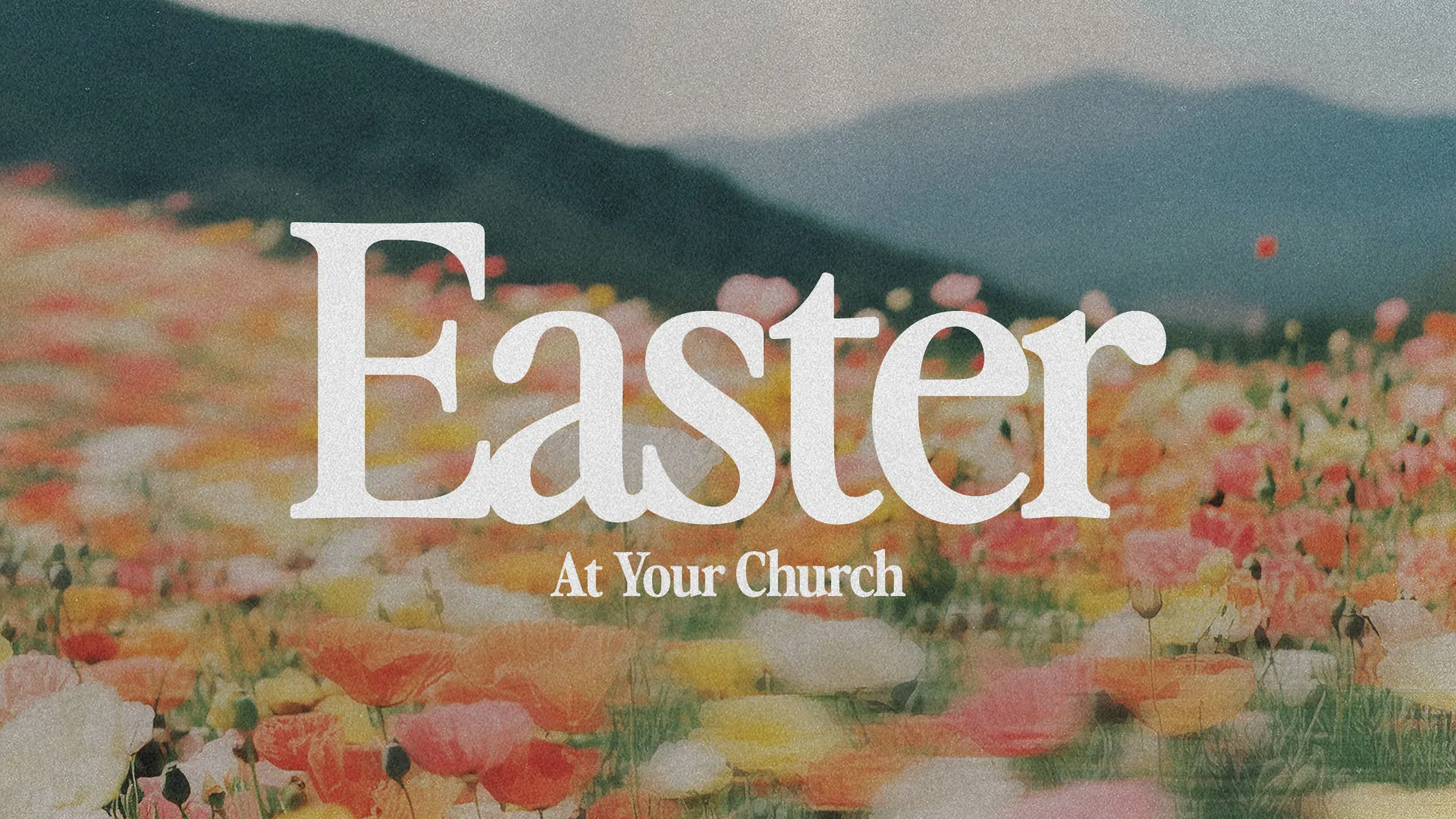 Easter church announcement featuring white typography over dreamy mountain landscape with red and yellow wildflowers in foreground