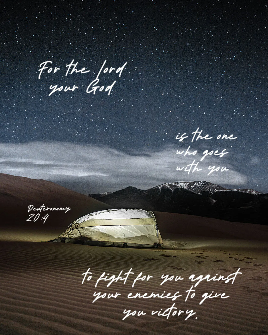Breathtaking church media graphic featuring Deuteronomy 20:4 "For the Lord your God is the one who goes with you to fight for you against your enemies to give you victory" overlaid on a stunning desert night scene with illuminated tent and starry sky.