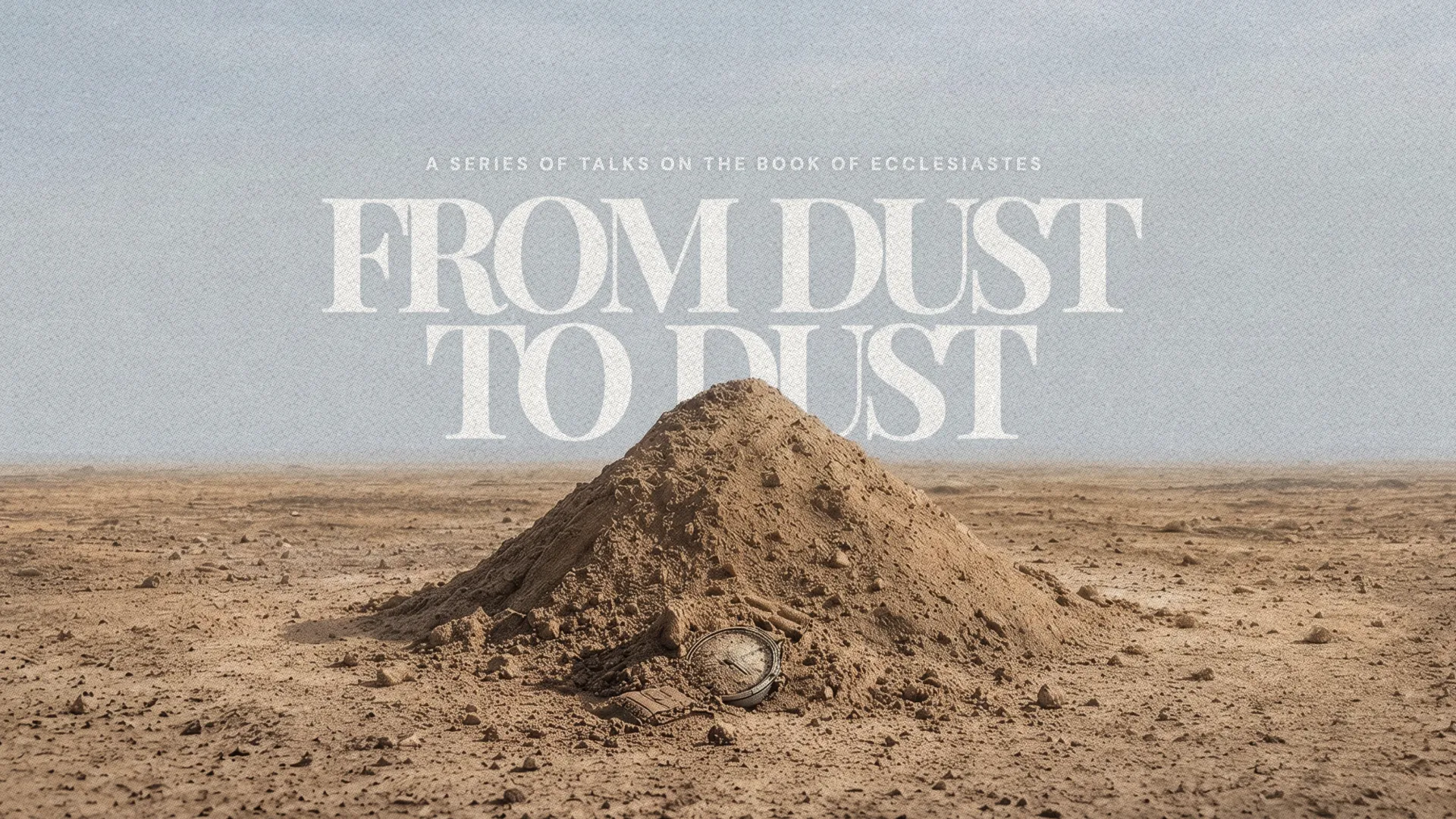 Dusty landscape with a mound of earth and a watch, symbolizing life's transience, reflecting Ecclesiastes themes.