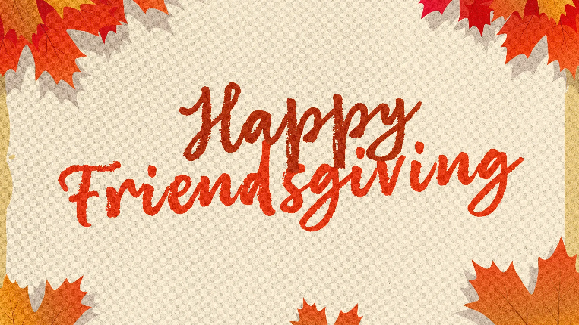 "Happy Friendsgiving" in red brush script on cream paper with orange and tan maple leaves in the corners
