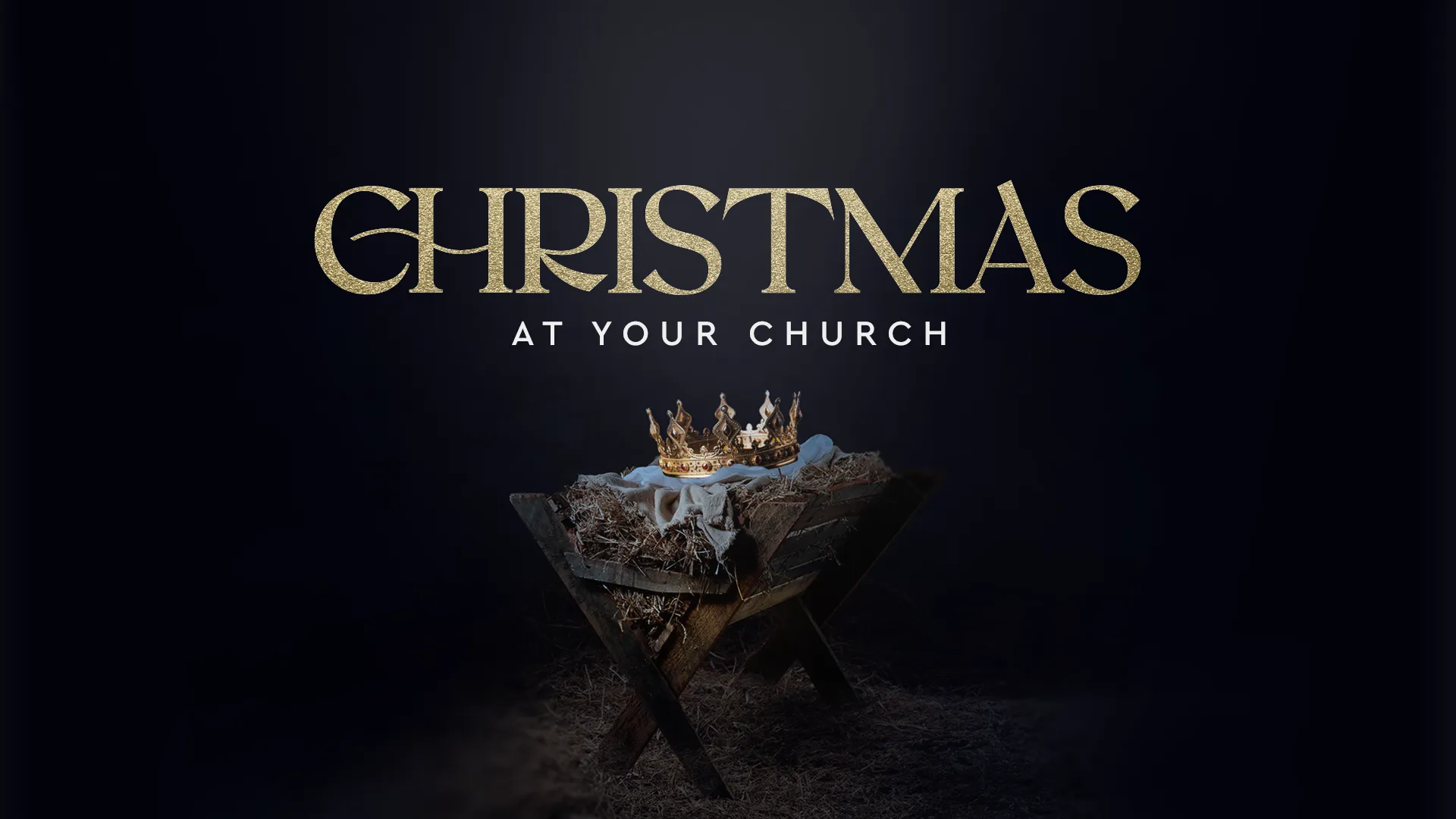 "Christmas" in gold serif type above a gold crown resting in a straw manger under a starry night sky