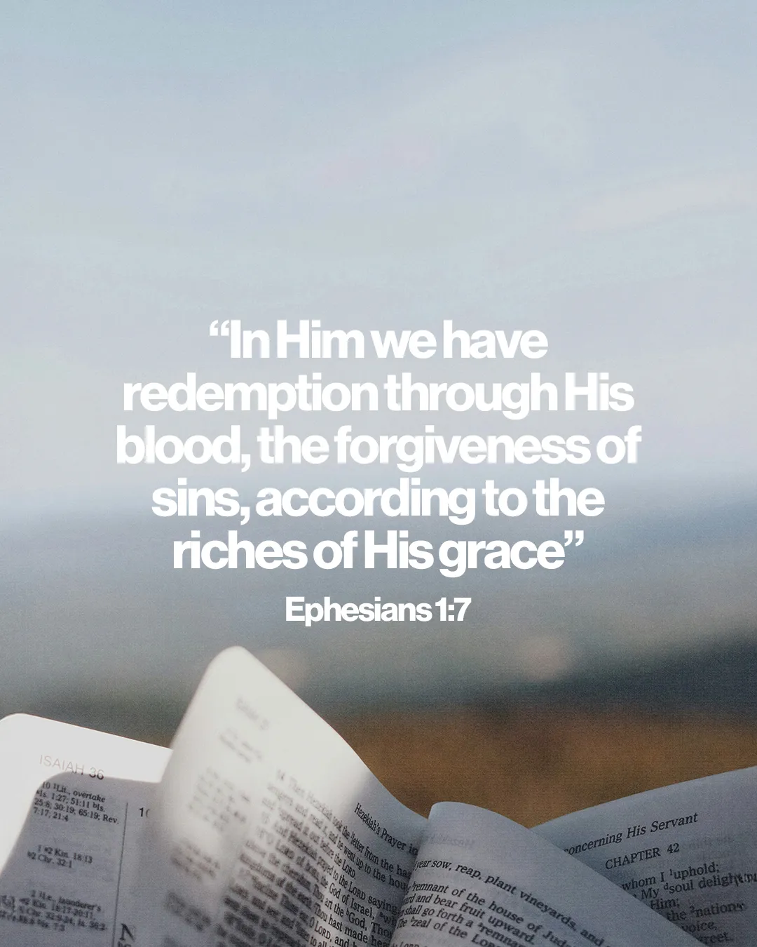 “Redemption and forgiveness through Christ’s grace,” Ephesians 1:7, with an open Bible against a serene background.