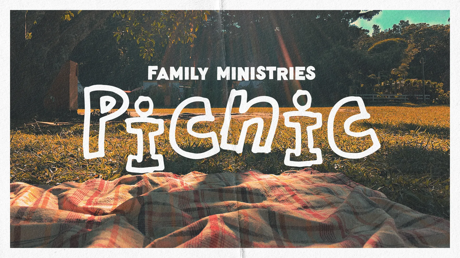 Family Ministries picnic invitation on a sunny day, featuring a blanket on grass, symbolizing community and fellowship.