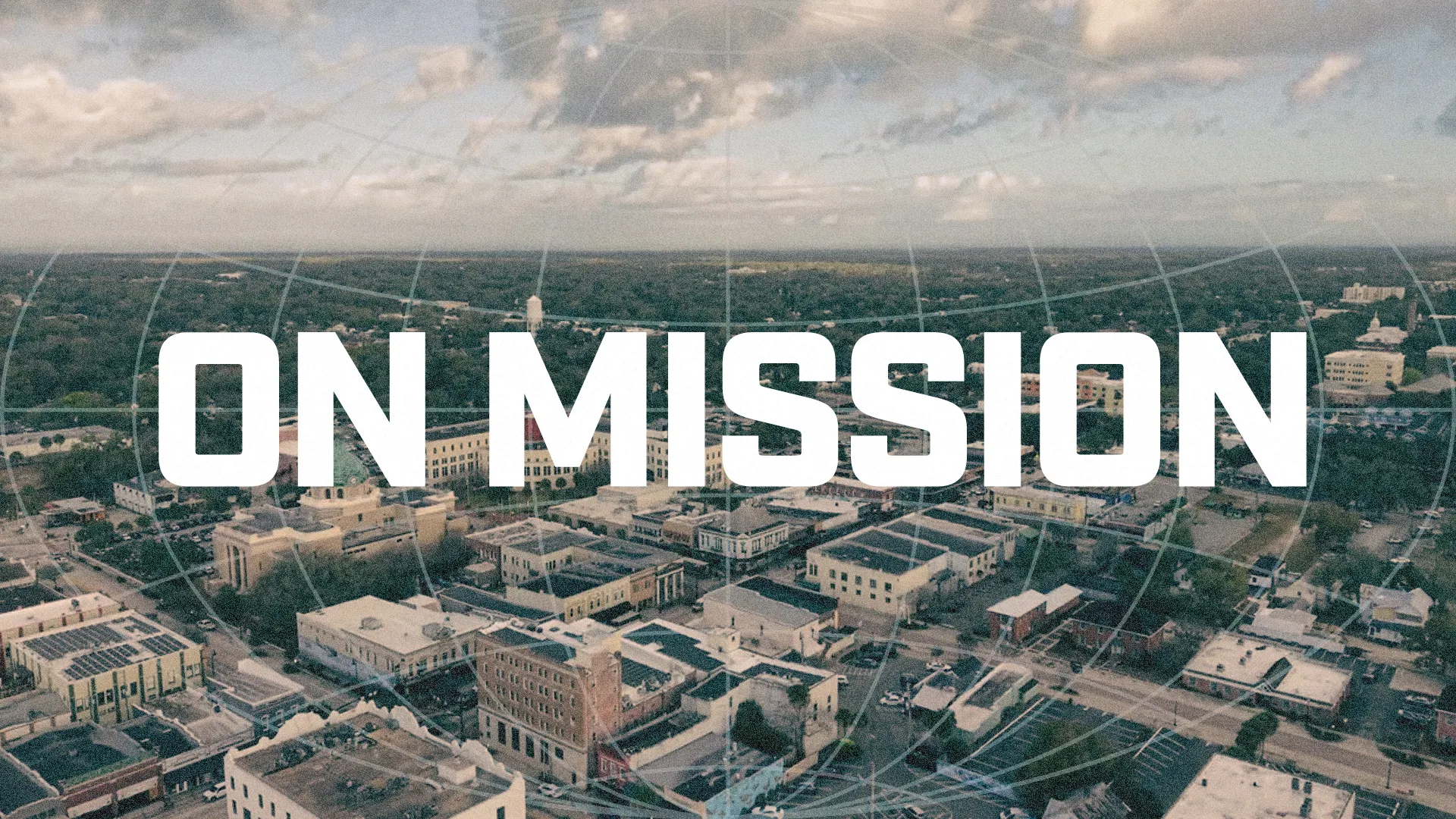 Aerial view of a community with the bold text "ON MISSION," symbolizing faith-driven outreach and service.