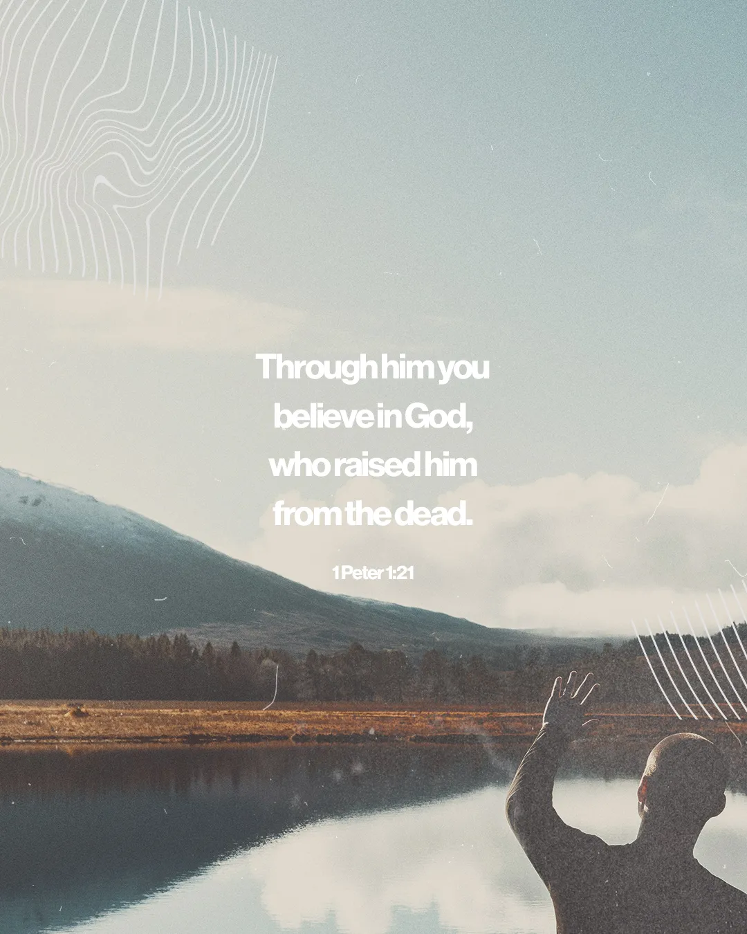 Person raising hand in worship by a serene lake, mountains in the background, reflecting faith and spiritual connection.