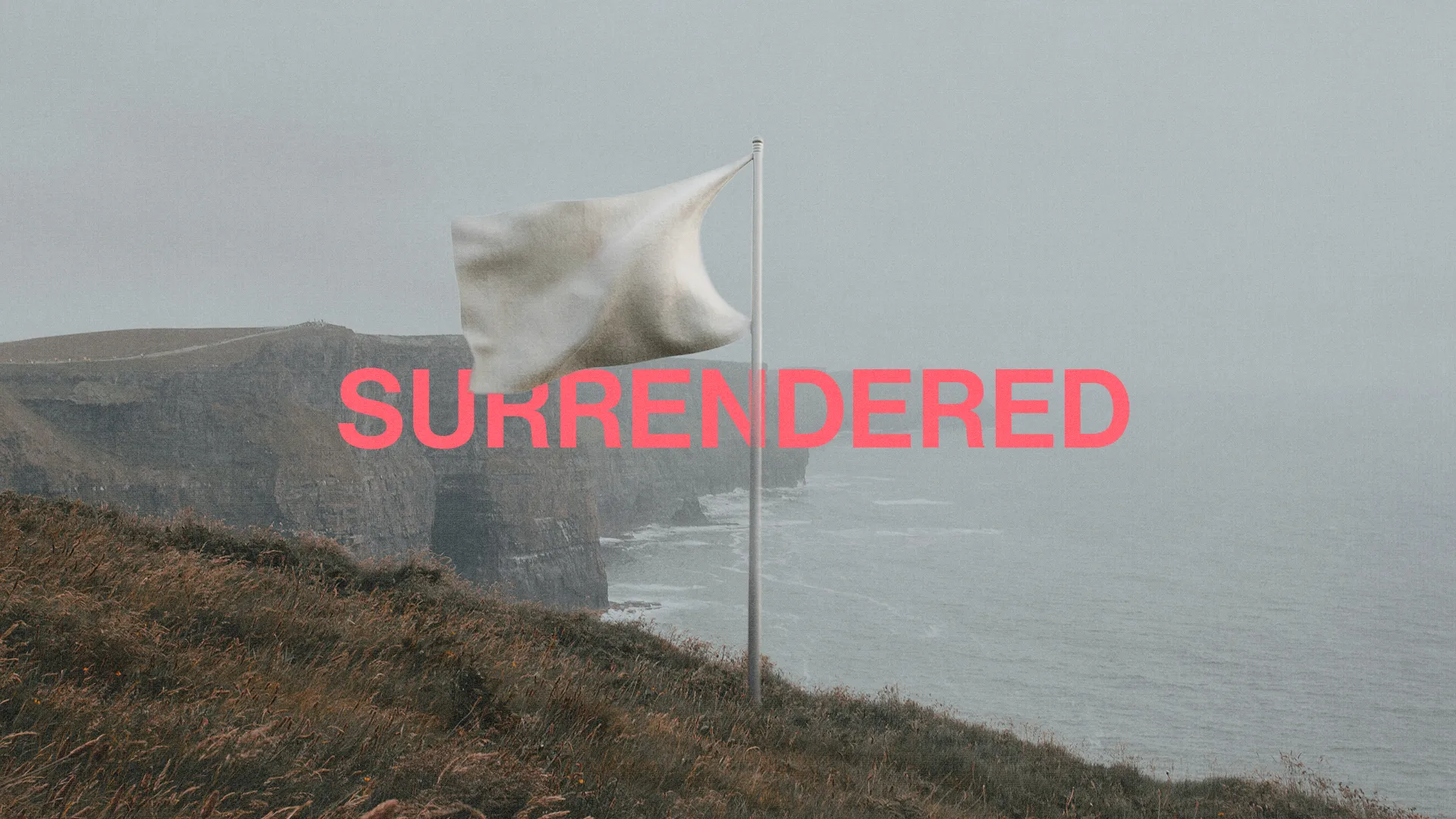 White flag on a cliffside, symbolizing surrender, with the word "SURRENDERED" in bold pink, evoking themes of faith and trust.