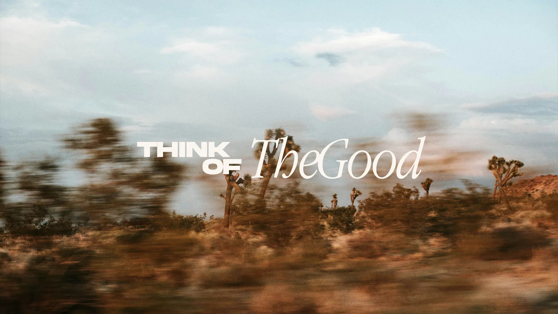 "Encouraging message to focus on positivity and faith, set against a serene desert landscape."